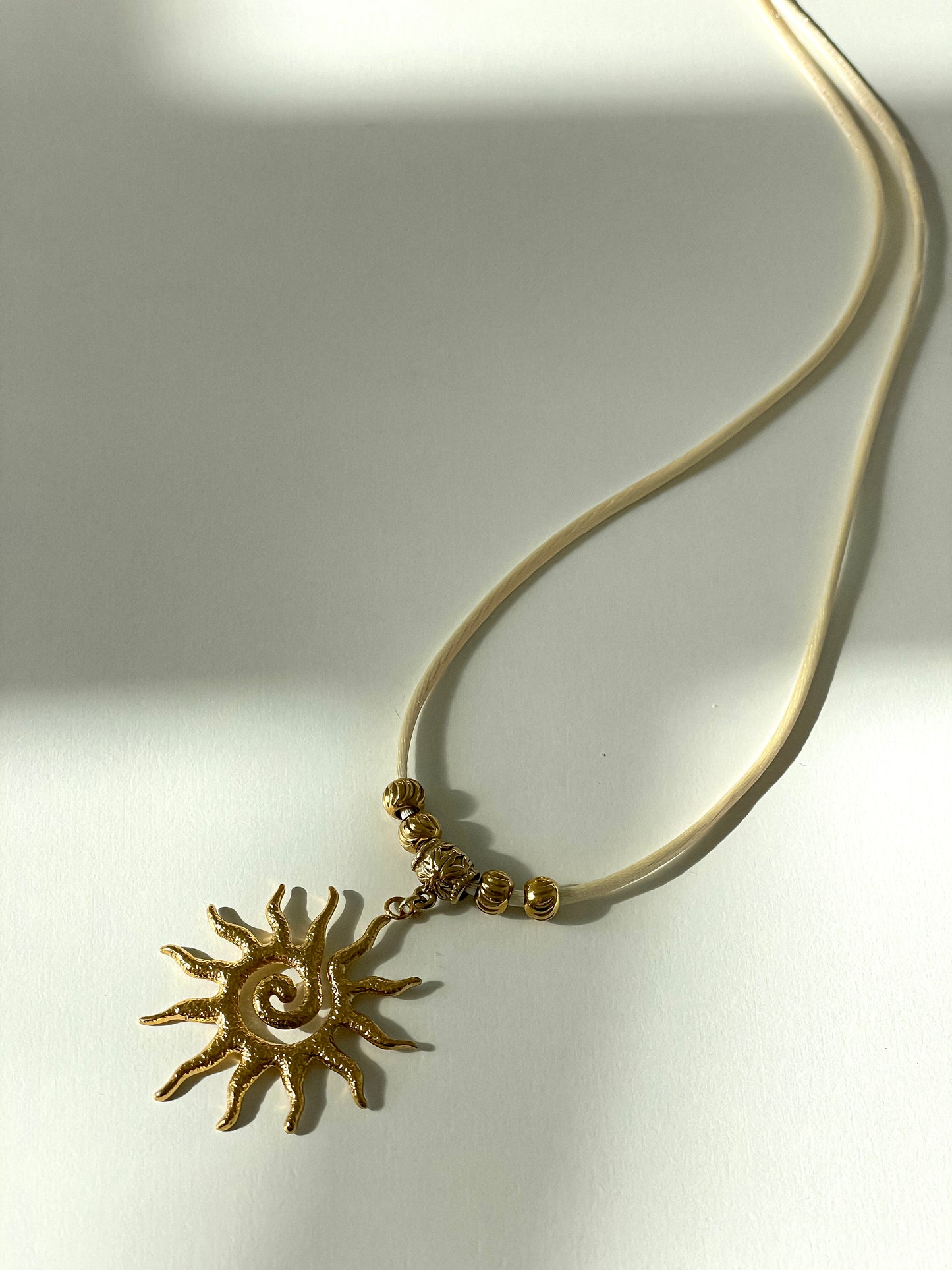Rising Sun Necklace (black or ivory)